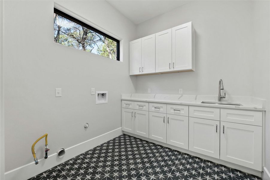 Laundry room with washer hookup, sink, gas dryer hookup, and cabinets