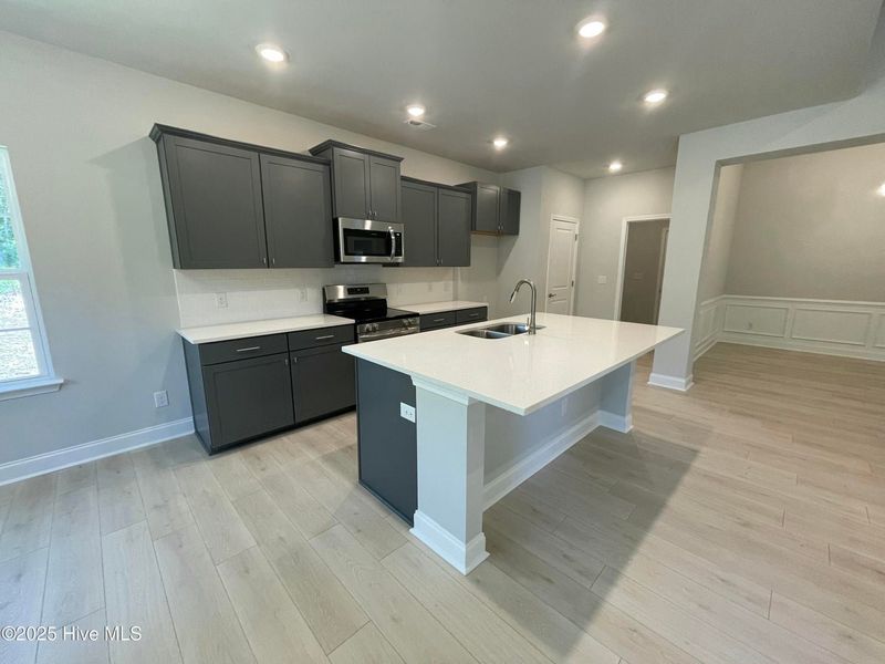Furnished interior view inside a new home in Wood Creek, Leland (Image 5).