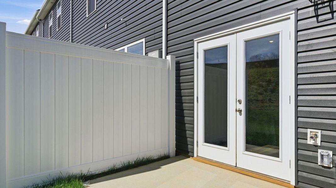 Exterior details and patio area of a home in The Arbor Townhomes, Kingsport (Image 4).
