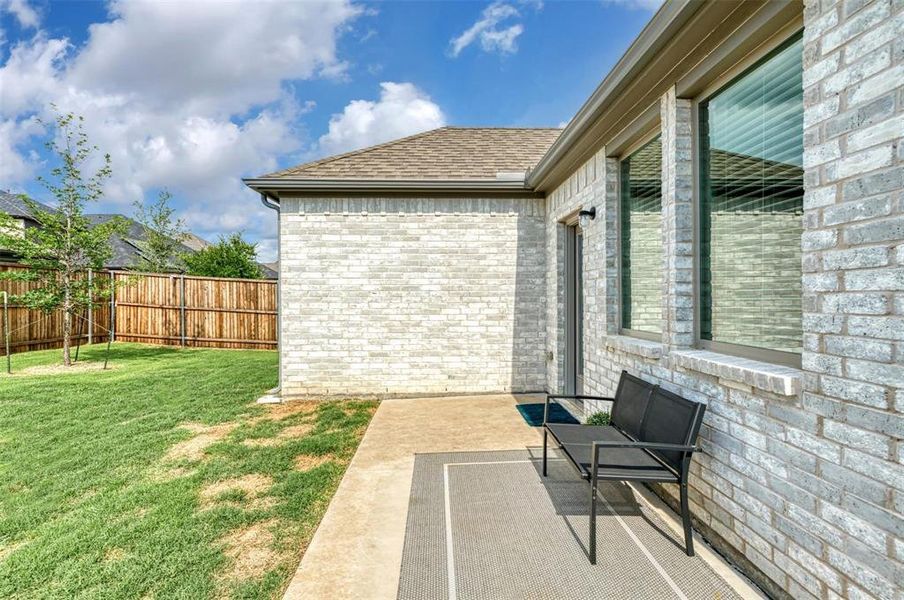 Fenced backyard with a patio Fenced backyard with a patio