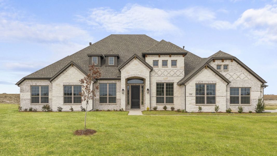 Front exterior of a new home in Levante, Waxahachie, TX, highlighting curb appeal (Image 1). Front exterior of a new home in Levante, Waxahachie, TX, highlighting curb appeal (Image 1).