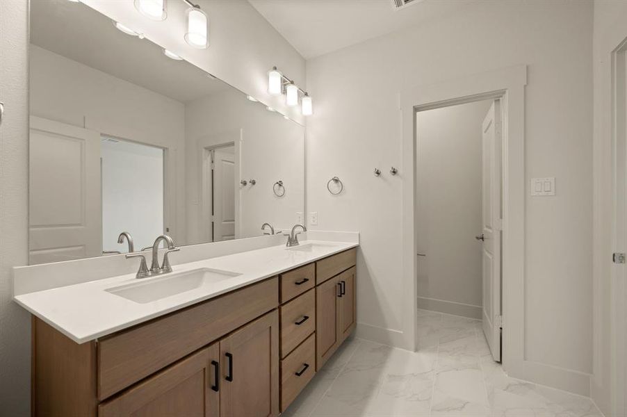 Ample room for two in this beautiful new owner's bath.