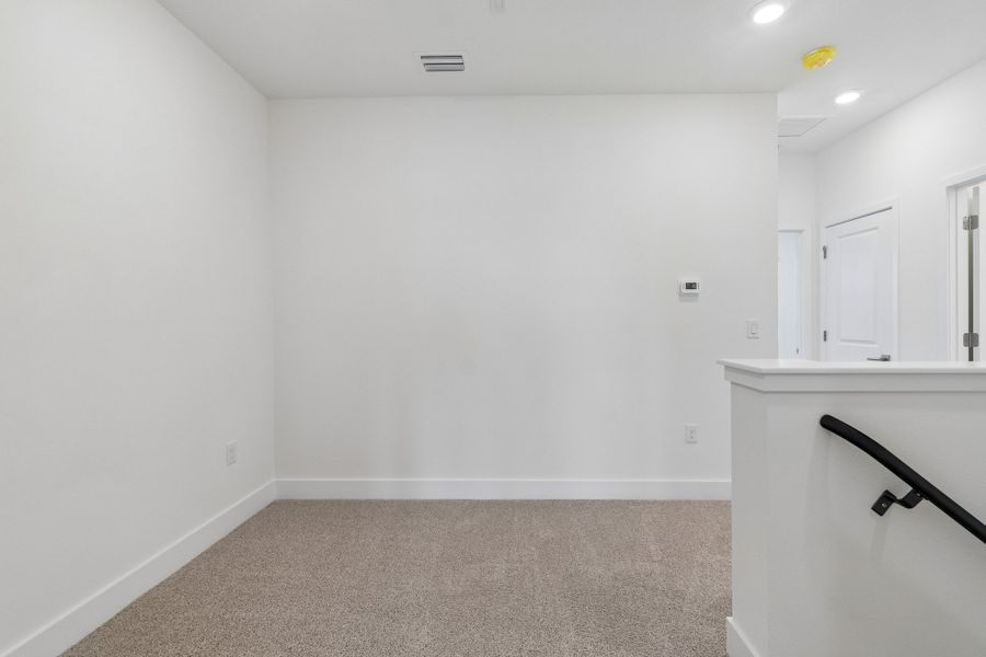 Spacious, unfurnished interior of a new home in Emerald Landing at Waterside at Lakewood Ranch – Towns, Sarasota (Image 12). Spacious, unfurnished interior of a new home in Emerald Landing at Waterside at Lakewood Ranch – Towns, Sarasota (Image 12).