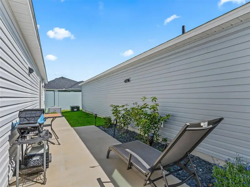Exterior details and patio area of a home in , The Villages (Image 29).