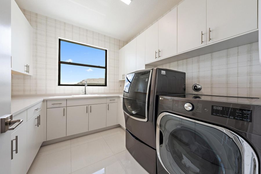 Upgraded washer, dryer, sink, and designer wallpaper.
