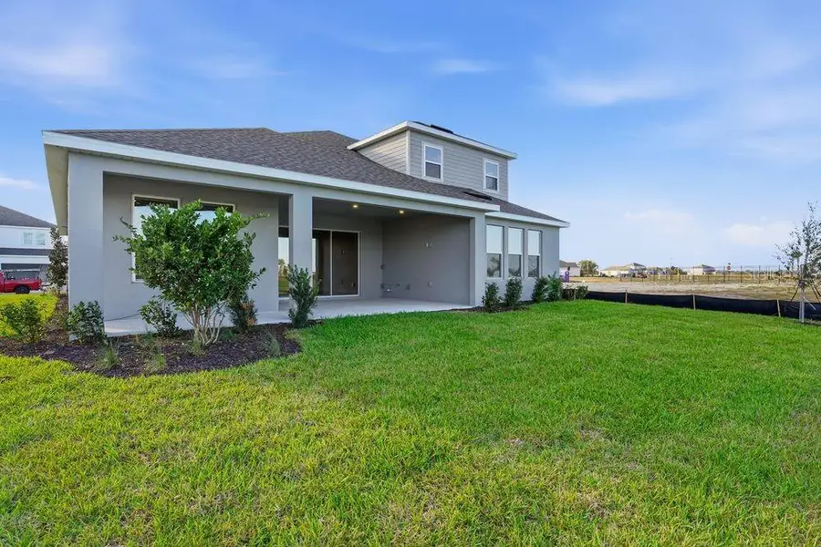 Exterior details and patio area of a home in Palms at Coasterra, Palmetto (Image 4).
