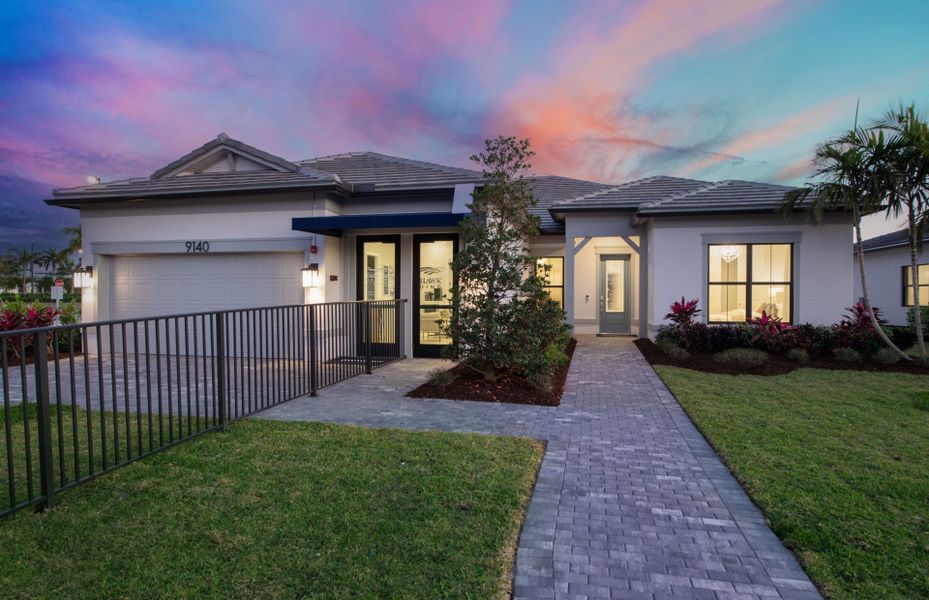 Front exterior of a new home in Greyhawk Landing, Lake Worth, FL, highlighting curb appeal (Image 1).