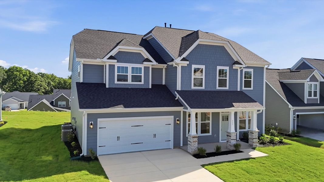 Front exterior of a new home in Kayfield at Midway, Anderson, SC, highlighting curb appeal (Image 20). Front exterior of a new home in Kayfield at Midway, Anderson, SC, highlighting curb appeal (Image 20).