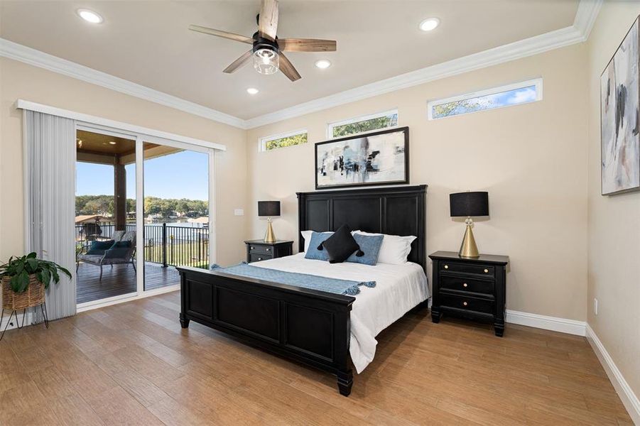 Bedroom with access to outside, ceiling fan, light hardwood / wood-style floors, and crown molding