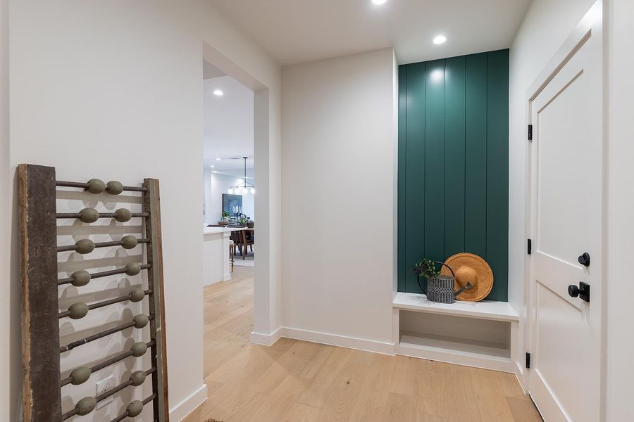 Mudroom with light wood-style floors and recessed lighting