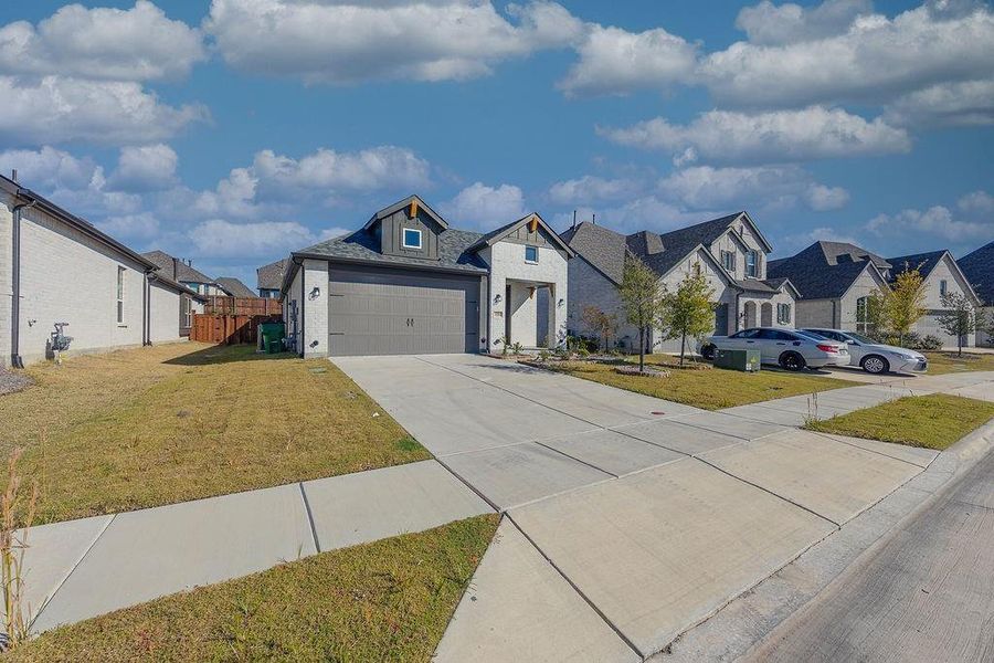 Front exterior of a new home in Devonshire, Forney, TX, highlighting curb appeal (Image 21).