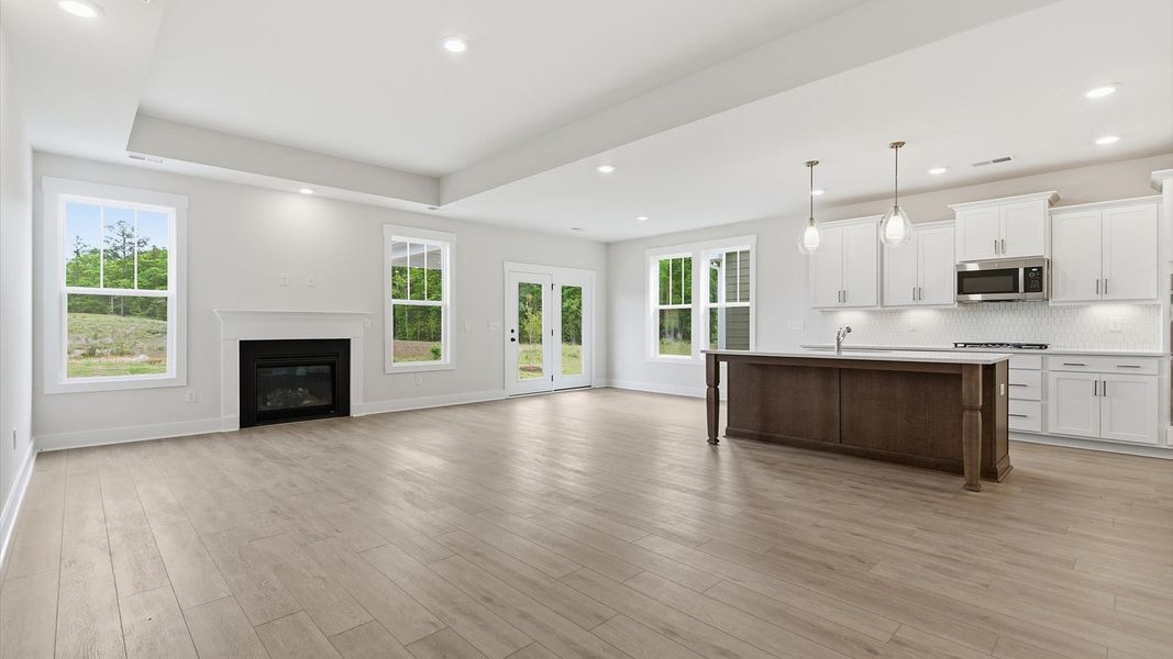 Superior design shines in this open-concept family room with timeless finishes and a modern edge at Mulberry Estates