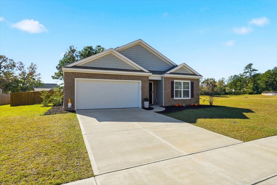 Front exterior of a new home in Stone Ridge, Moncks Corner, SC, highlighting curb appeal (Image 22).