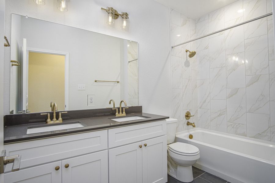 Representative furnished interior of a home built from the The Palmer by Rosehaven Homes in Magnolia Village, San Antonio (Image 10).