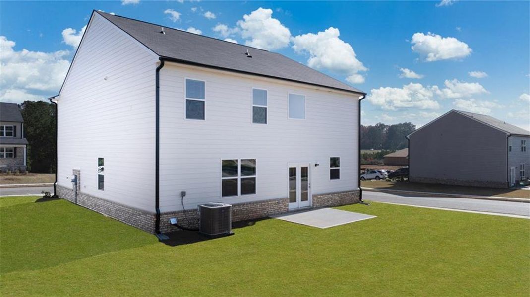 Front exterior of a new home in The Reserve at Calcutta, Stockbridge, GA, highlighting curb appeal (Image 22). Front exterior of a new home in The Reserve at Calcutta, Stockbridge, GA, highlighting curb appeal (Image 22).