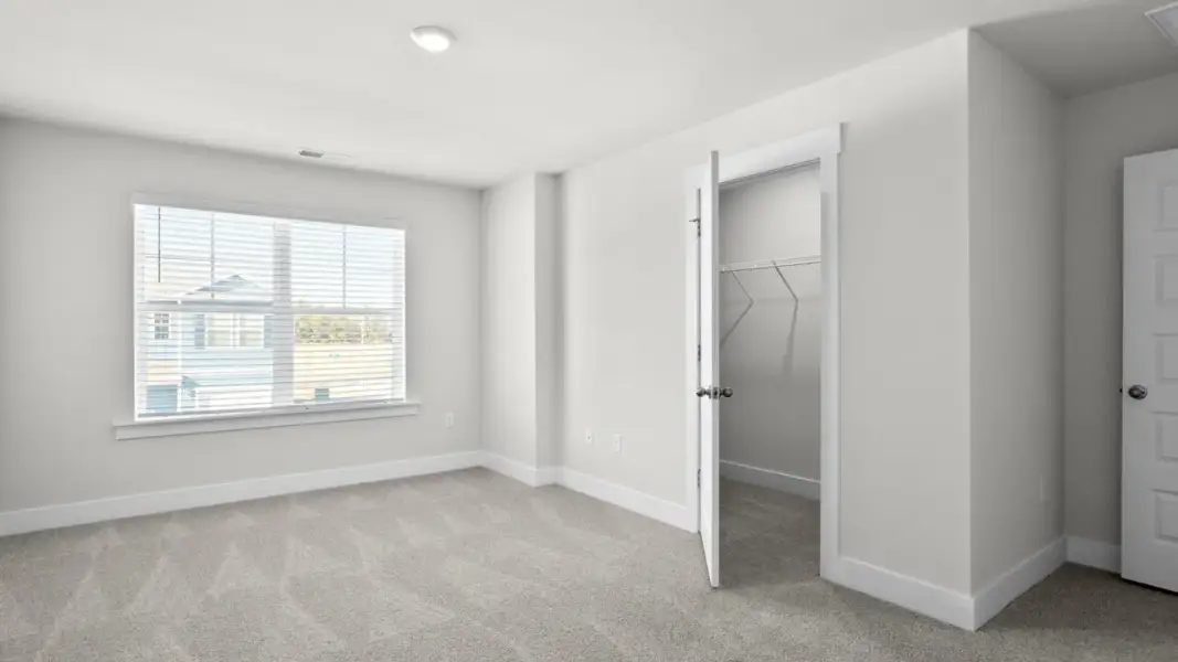 Spacious, unfurnished interior of a new home in The Townes at Cedar Hill Landing, Navassa (Image 20).