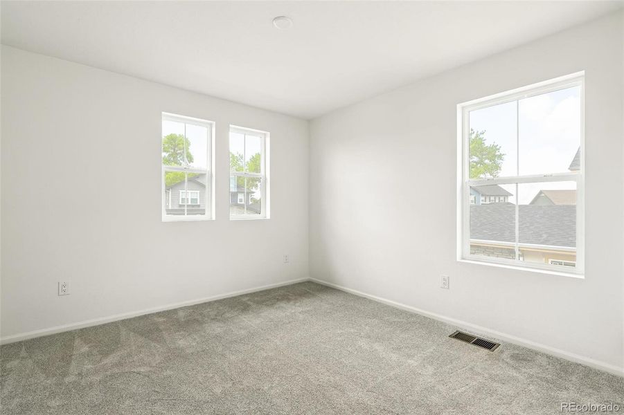 Spacious, unfurnished interior of a new home in Windsong, Thornton (Image 23).