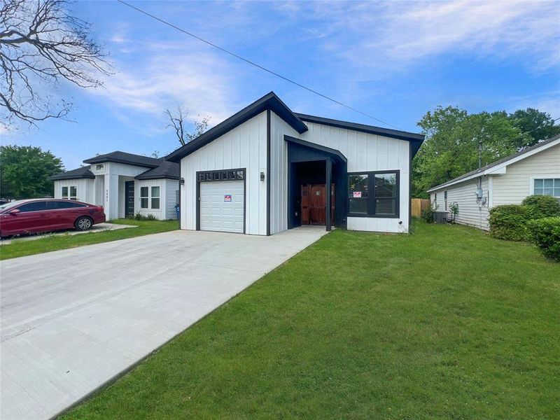 Front exterior of a new home in , Dallas, TX, highlighting curb appeal (Image 1).