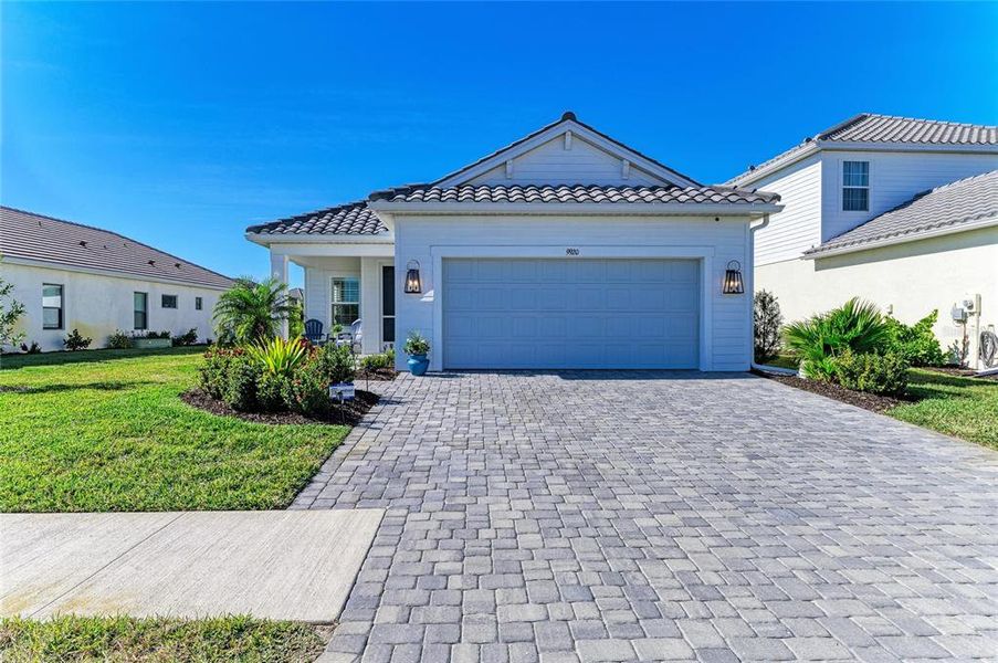 Front exterior of a new home in , Sarasota, FL, highlighting curb appeal (Image 1). Front exterior of a new home in , Sarasota, FL, highlighting curb appeal (Image 1).