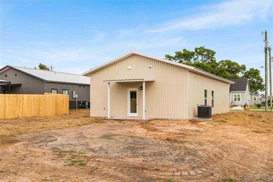Back of property with central air condition unit Back of property with central air condition unit