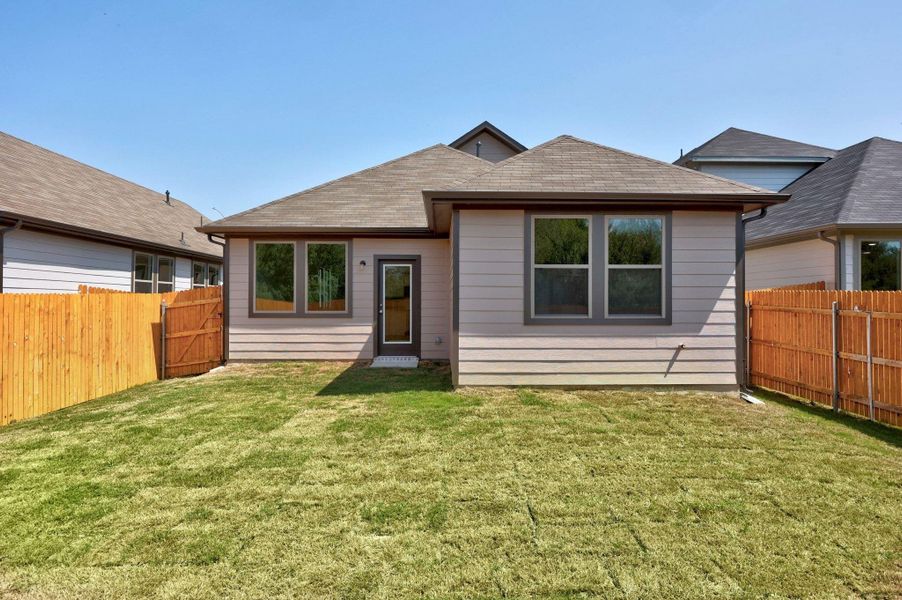 Front exterior of a new home in Trinity Ranch, Elgin, TX, highlighting curb appeal (Image 21).
