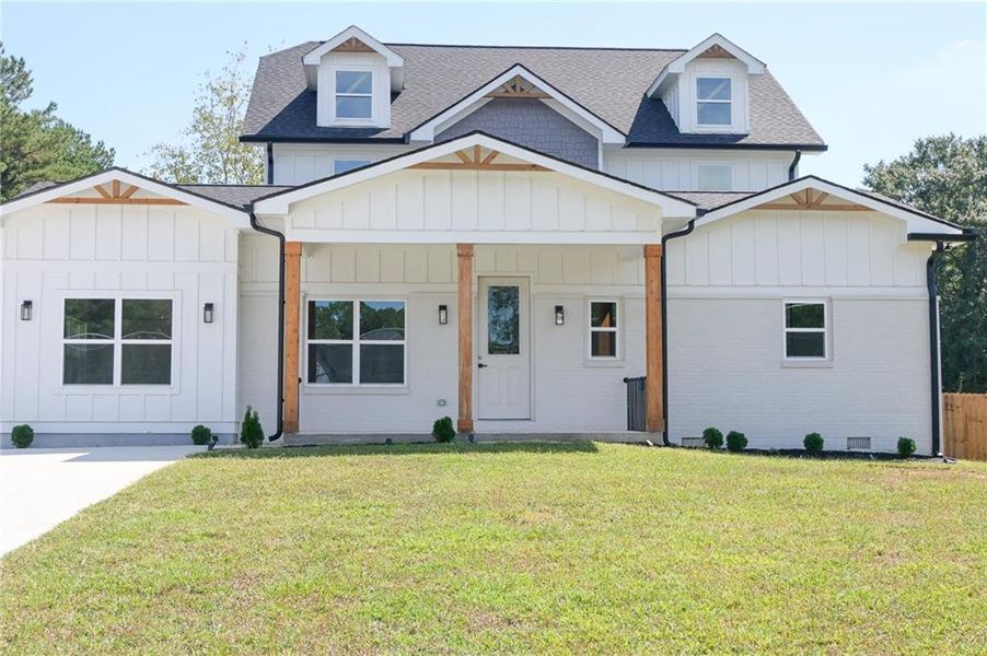 Front exterior of a new home in , Loganville, GA, highlighting curb appeal (Image 32).
