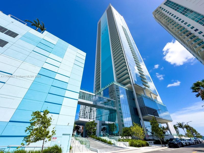 Front exterior of a new home in Missoni Baia, Miami, FL, highlighting curb appeal (Image 19).