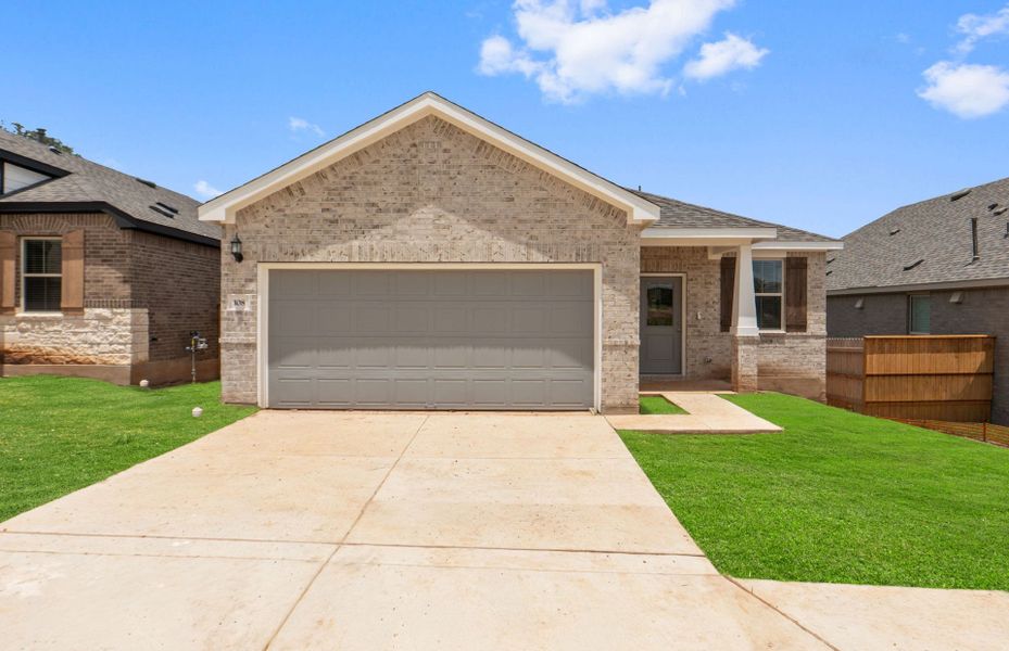 Front exterior of a new home in La Cima, San Marcos, TX, highlighting curb appeal (Image 26).