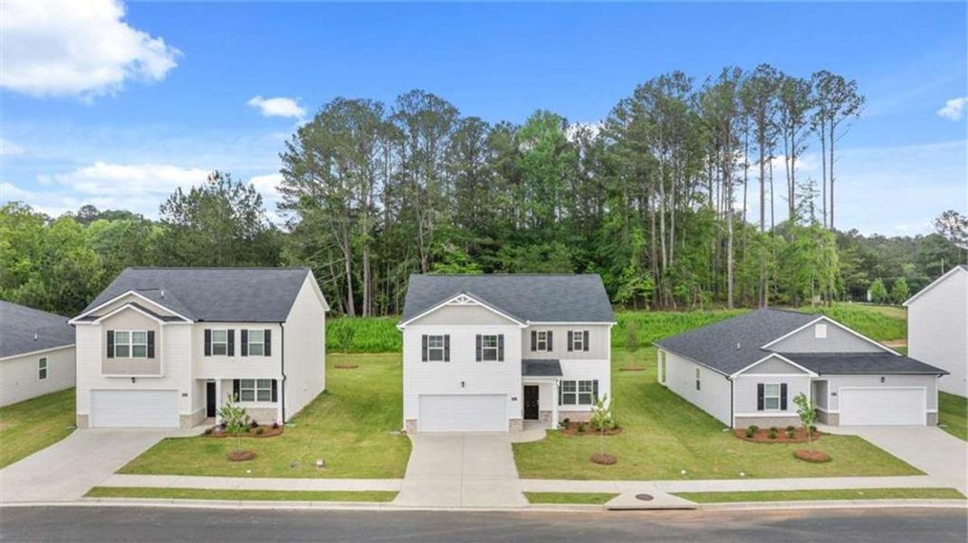 Front exterior of a new home in Poplar Preserve, Newnan, GA, highlighting curb appeal (Image 19). Front exterior of a new home in Poplar Preserve, Newnan, GA, highlighting curb appeal (Image 19).