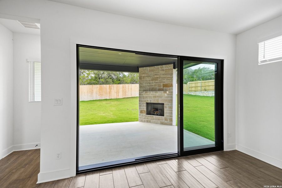 Exterior details and patio area of a home in The Reserve at Potranco Oaks, Castroville (Image 27).