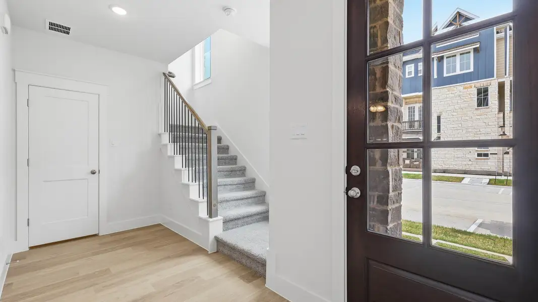 Furnished interior view inside a new home in Collin Creek, Plano (Image 7).