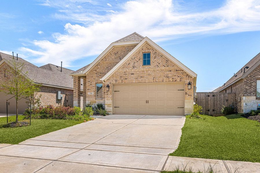 Front exterior of a new home in The Grand Prairie, Hockley, TX, highlighting curb appeal (Image 20).