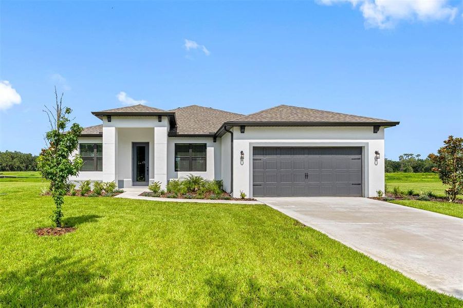 Front exterior of a new home in Lake Gallagher Estates, Dover, FL, highlighting curb appeal (Image 1).