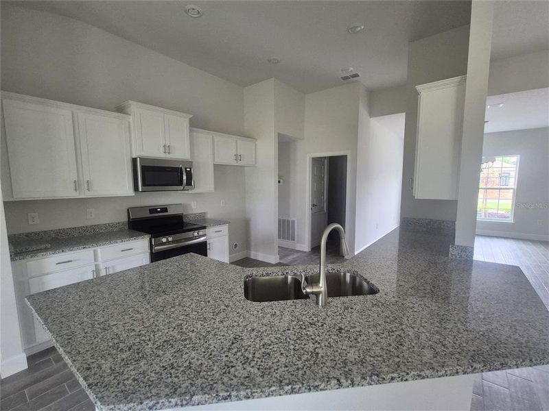 Furnished interior view inside a new home in Hill Country Estates, Dade City (Image 18).