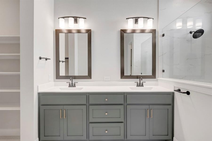 Bathroom with double vanity and a tile shower Bathroom with double vanity and a tile shower