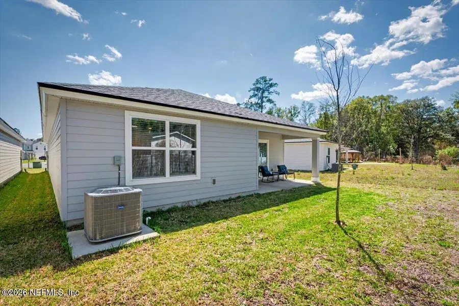 Exterior details and patio area of a home in Kings Landing, Jacksonville (Image 25).