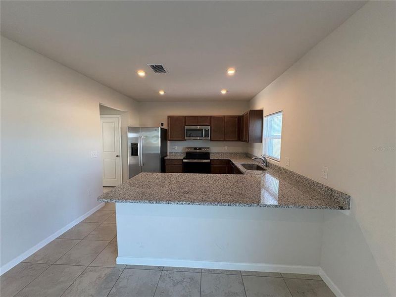 Furnished interior view inside a new home in , Haines City (Image 12).