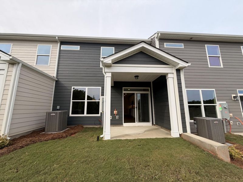 Exterior details and patio area of a home in Blythe Mill Townhomes, Waxhaw (Image 3).
