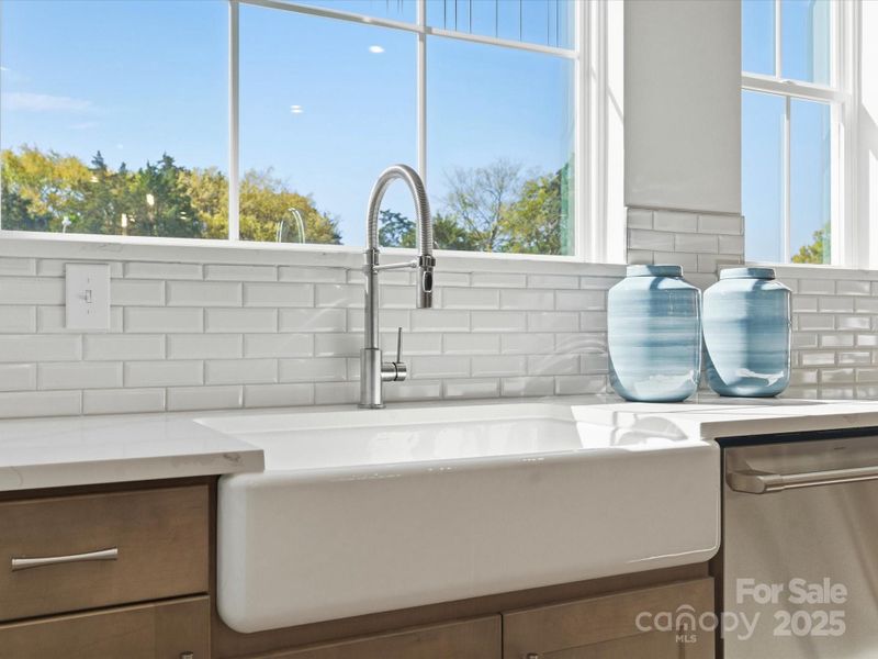 Large Windows Above Modern Single Basin Sink. *Model Photos | Actual Finishes, Structural Selections, and Orientation May Vary.