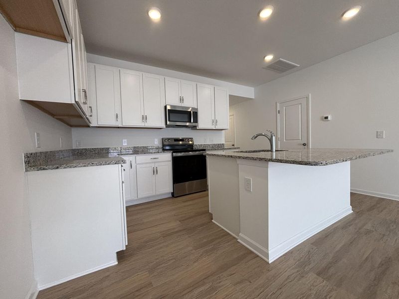 Furnished interior view inside a new home in CraigStone, Woodruff (Image 5).