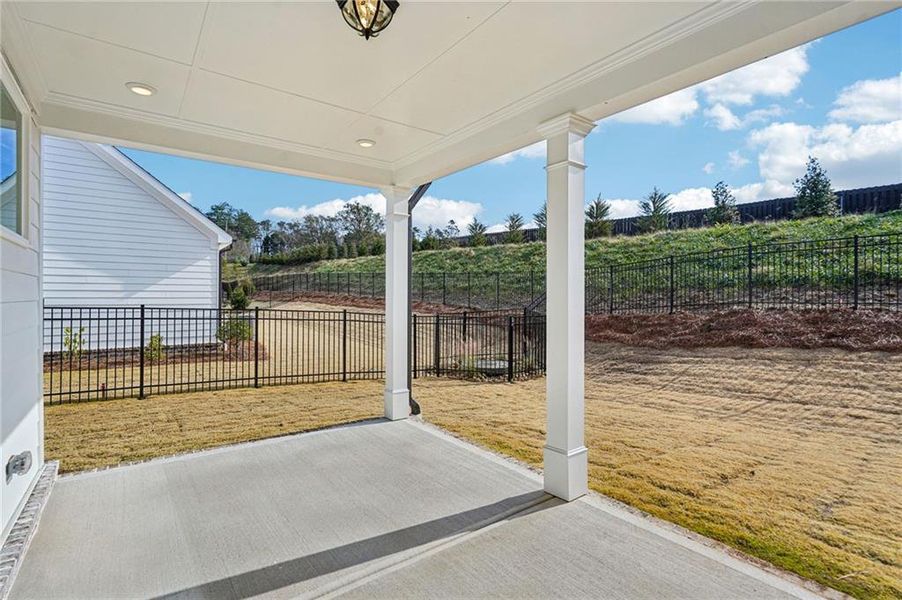 Exterior details and patio area of a home in Promenade at Sawnee Village, Cumming (Image 24).