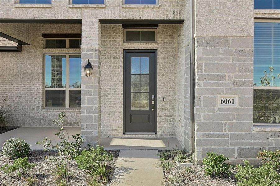 Front exterior of a new home in Oak Creek Ranch, Midlothian, TX, highlighting curb appeal (Image 1).