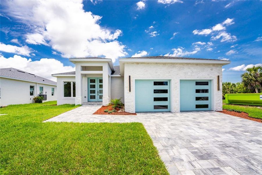 Front exterior of a new home in , Rotonda West, FL, highlighting curb appeal (Image 26).