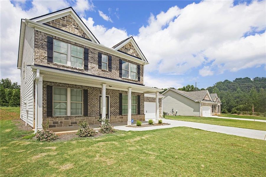 Front exterior of a new home in Vineyard Park, Griffin, GA, highlighting curb appeal (Image 15).