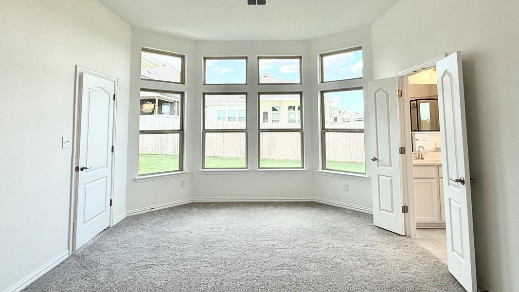 Furnished interior view inside a new home in Carillon, Manor (Image 13).