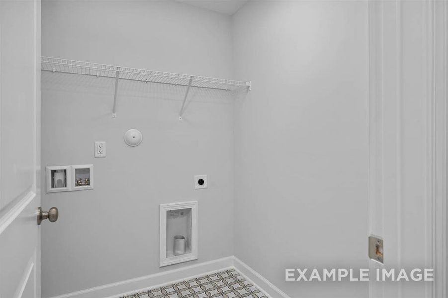 Washroom featuring hookup for an electric dryer, washer hookup, and hookup for a gas dryer