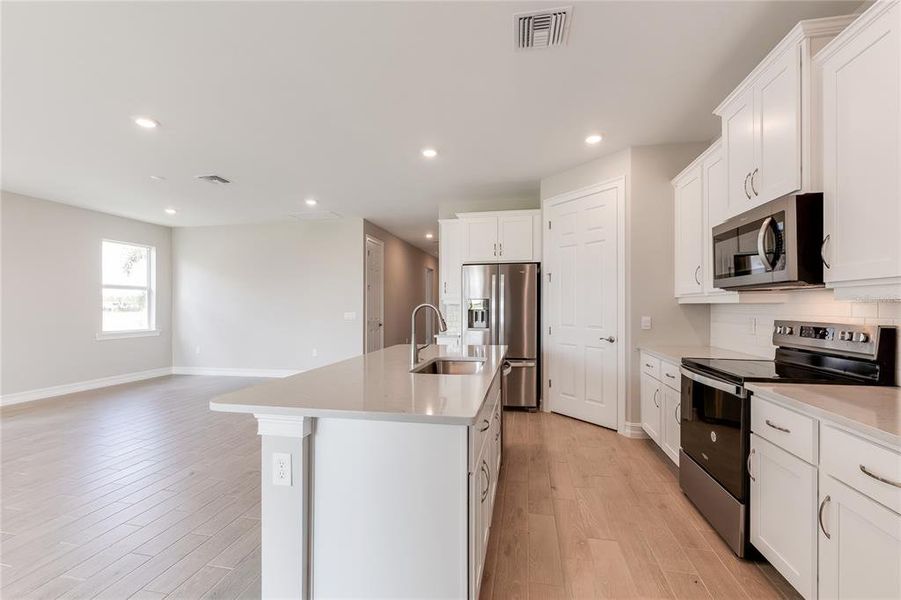 Furnished interior view inside a new home in Coral Lakes - Tradition & Express, Punta Gorda (Image 10).