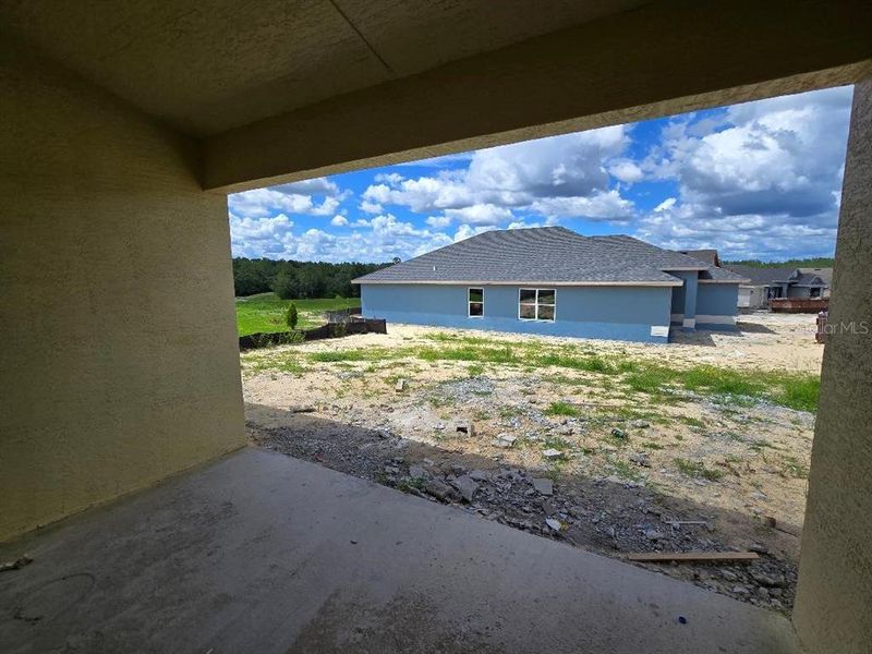 Front exterior of a new home in Twisted Oaks, Beverly Hills, FL, highlighting curb appeal (Image 2).