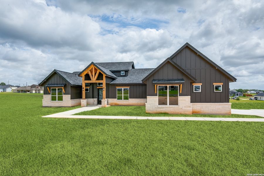 Front exterior of a new home in , La Vernia, TX, highlighting curb appeal (Image 1). Front exterior of a new home in , La Vernia, TX, highlighting curb appeal (Image 1).