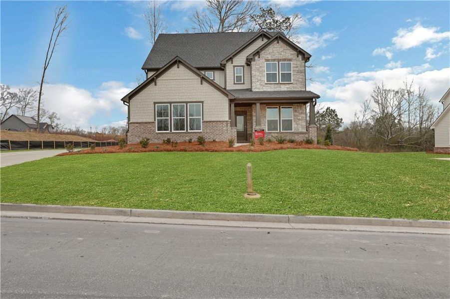 Front exterior of a new home in Acacia, Cumming, GA, highlighting curb appeal (Image 2). Front exterior of a new home in Acacia, Cumming, GA, highlighting curb appeal (Image 2).